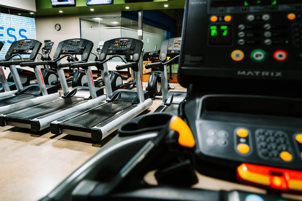 Treadmills with no one on them.