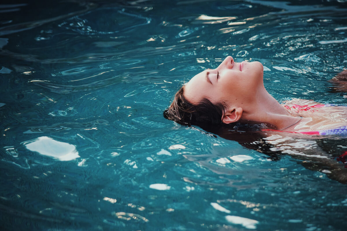 Woman swimming in a pool.