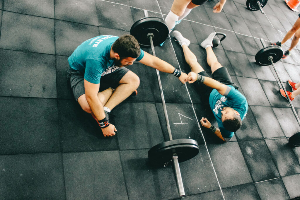 Gym buddies cheering each other on.